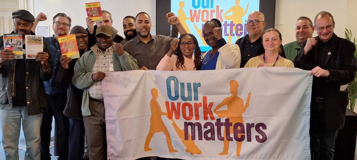 Outsourced workers with Our Work Matters banner
